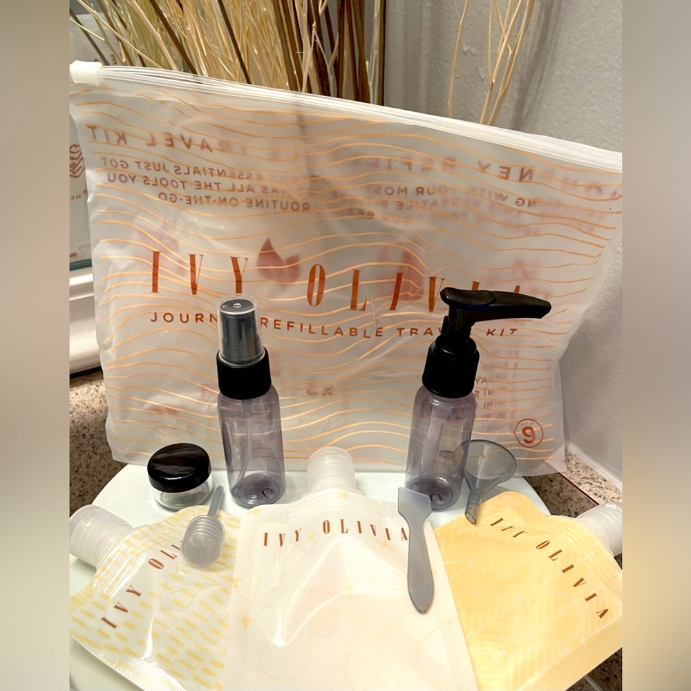 New! Never used! 9 piece Ivy & Olivia Journey Refillable Travel Kit!